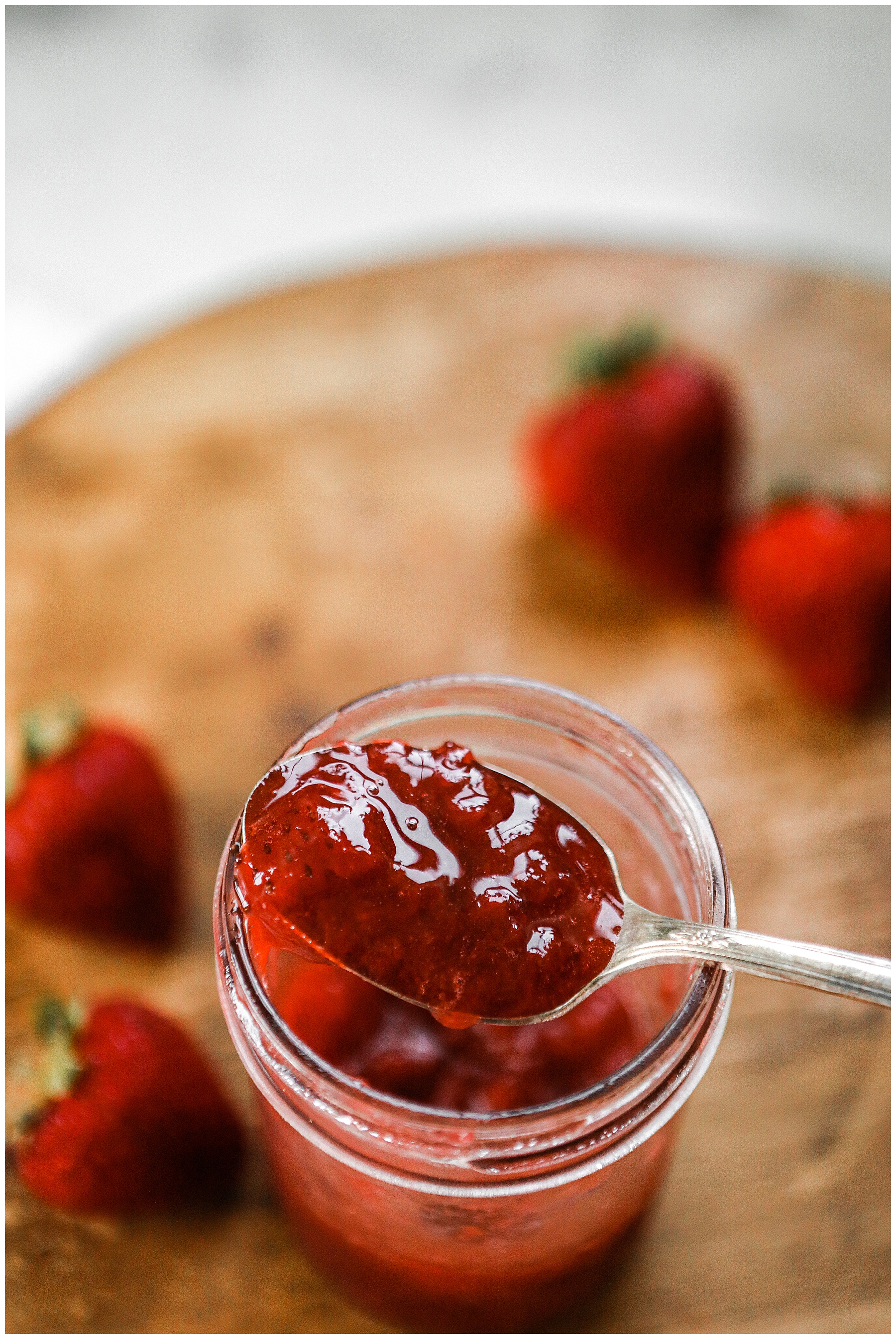 Spoon with strawberry jam