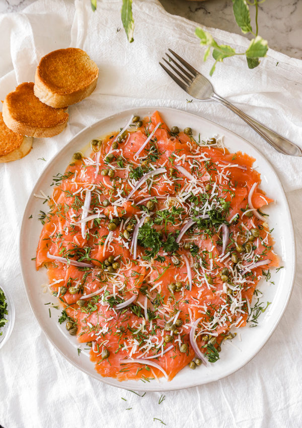Smoked salmon carpaccio with capers & herbs